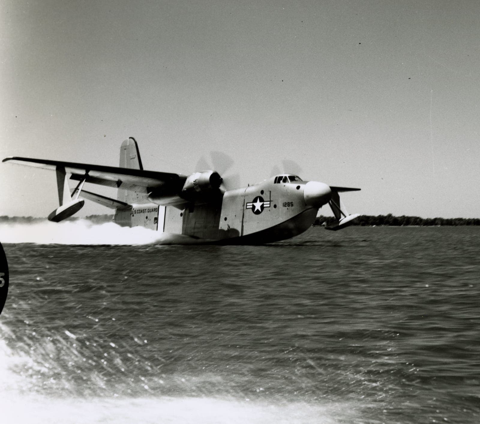U.S. Coast Guard seaplane landing on water — from Andrew's service era